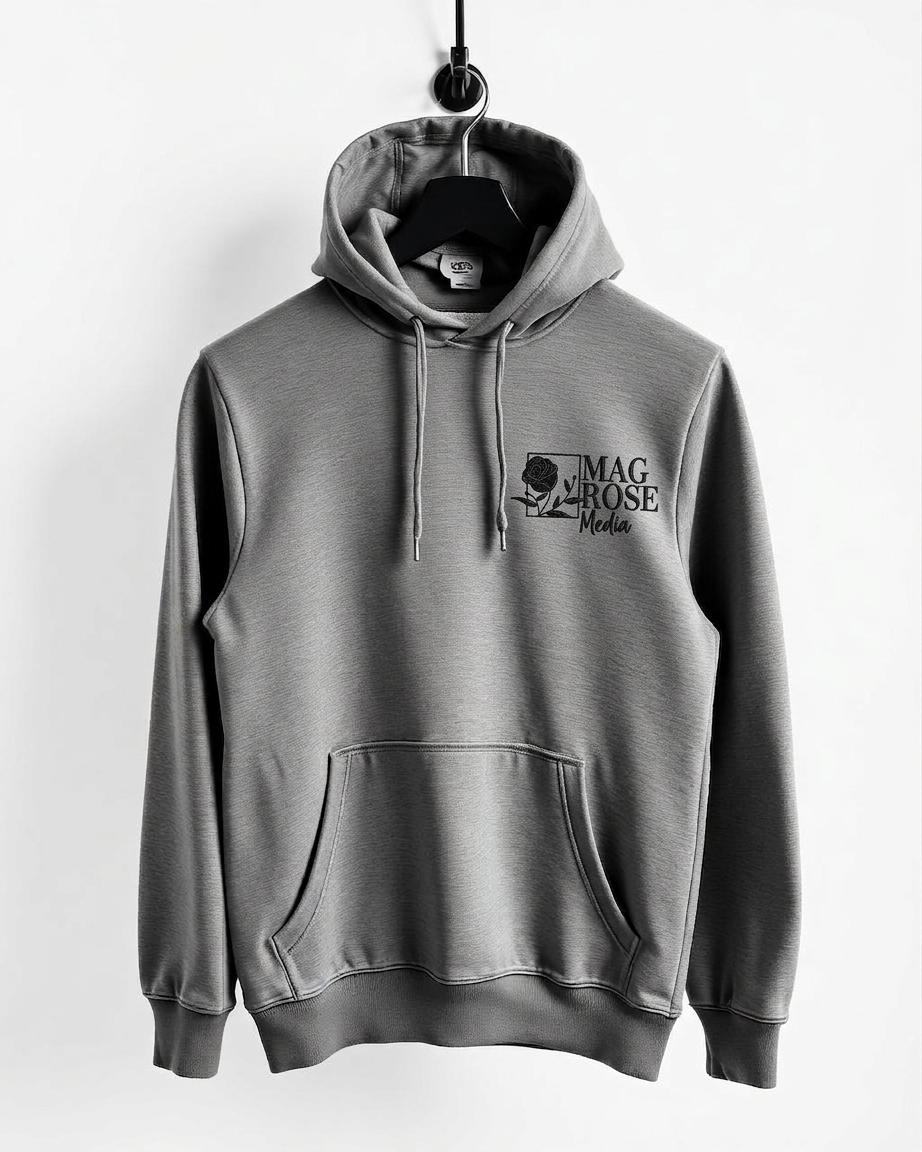 Heather grey MagRose Crew hoodie on a hook